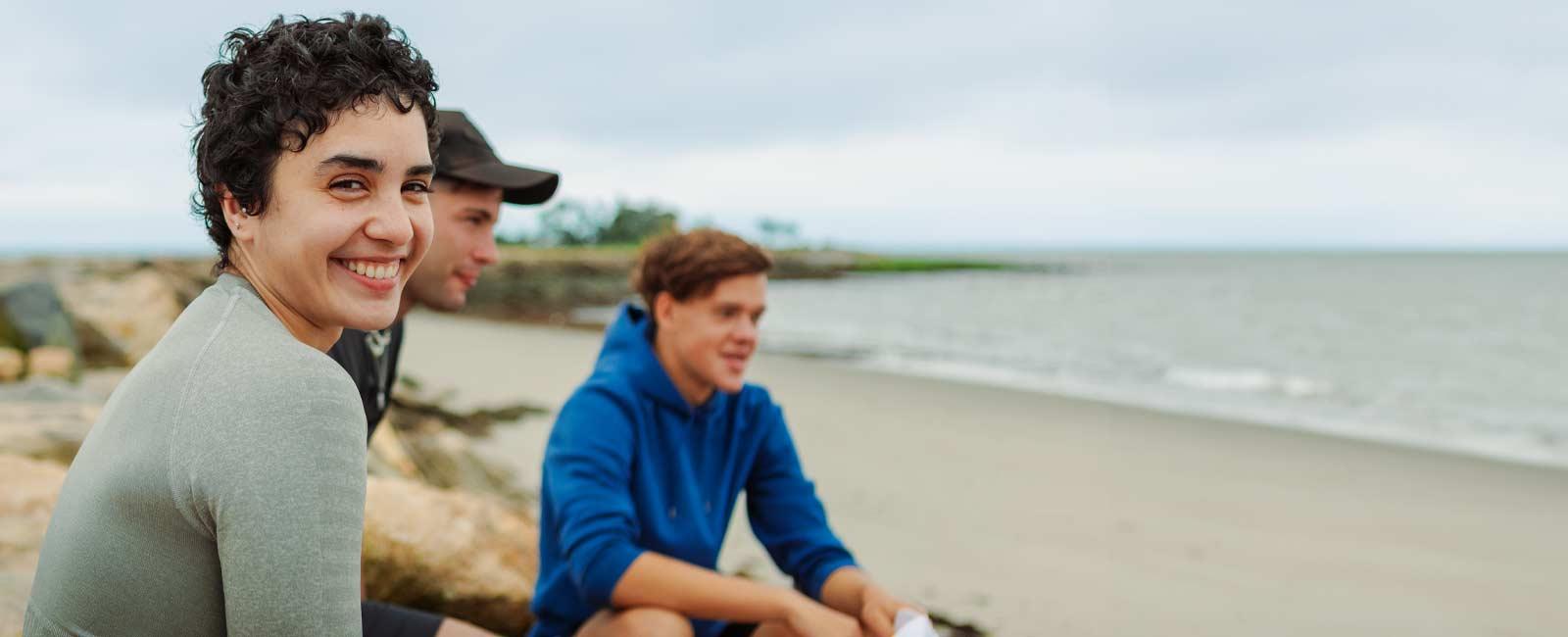 Smiling UB Students on the beach