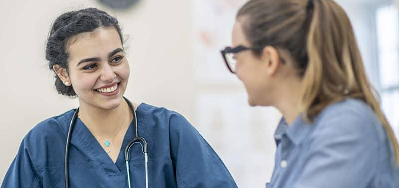 two nursing students talking